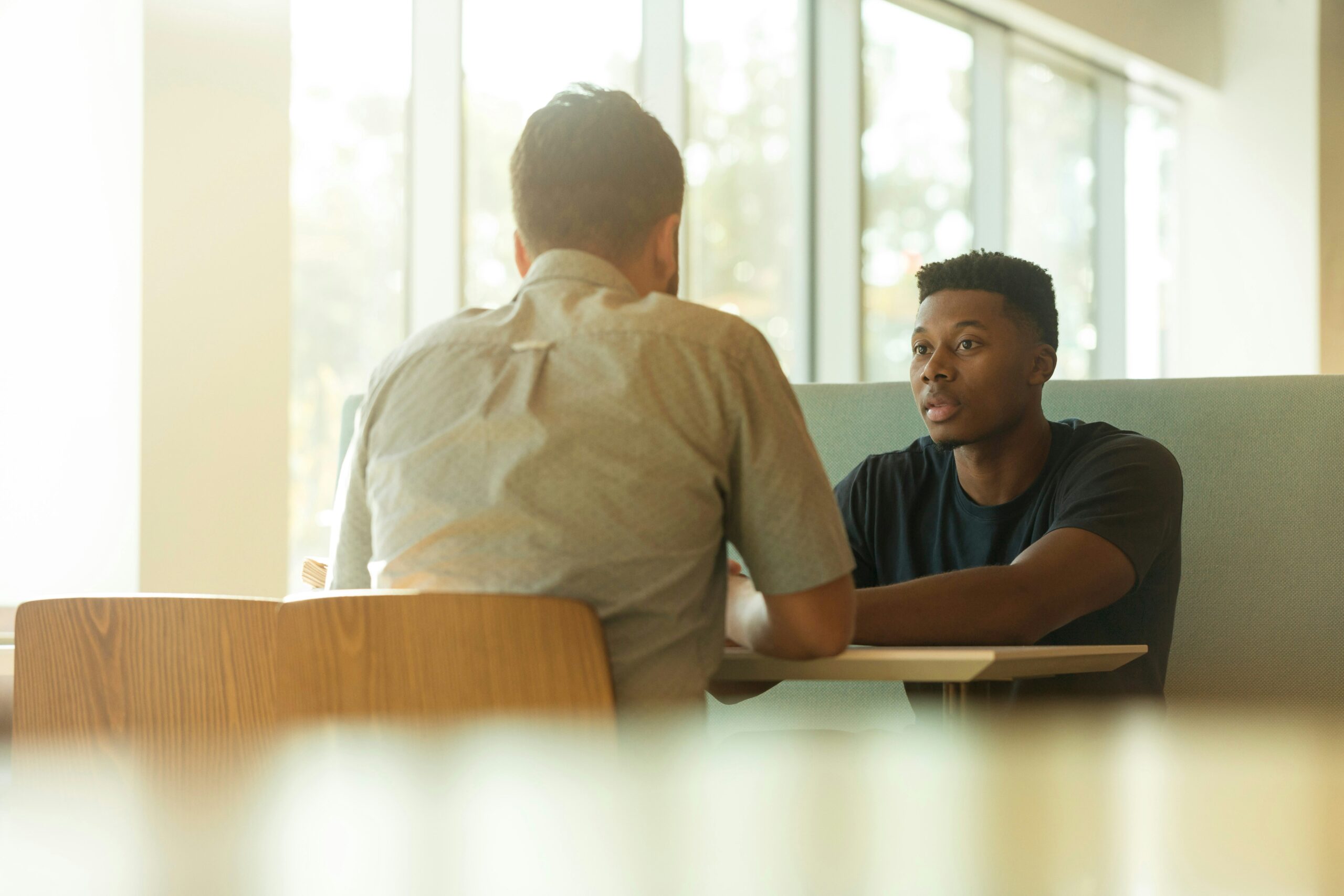How to Ask for a Letter of Recommendation pictured: men sitting and talking