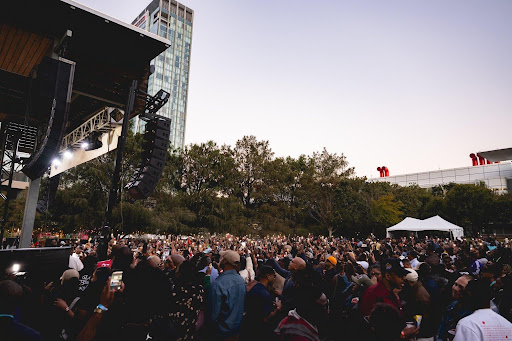 Attendees light up the Blavity House Party Block Party during AfroTech 2025 in Houston.